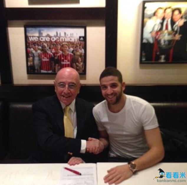 Put it there: Adel Taarabt (with AC Milan vice president Adriano Galliani) signs for AC Milan